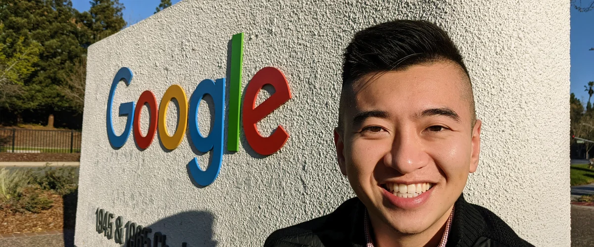 Shawn Sieu, Head of Learning & Development at Google, standing outside in front of a Google sign