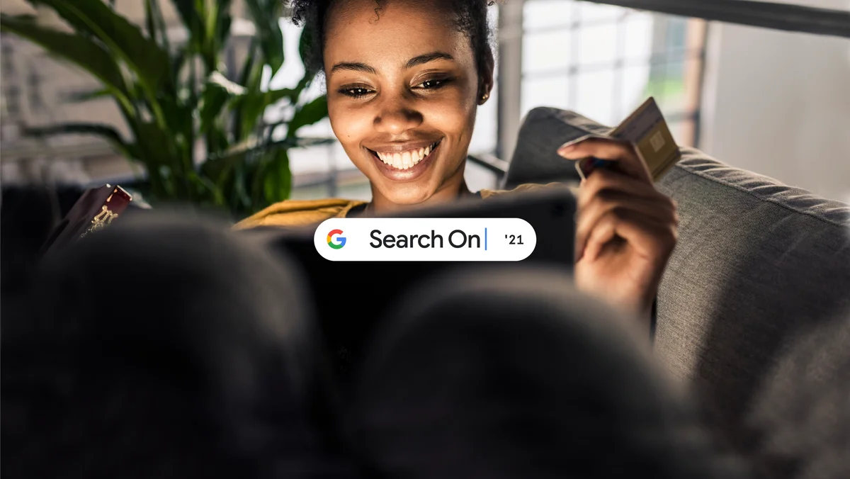 A woman sitting on the sofa, online shopping from her computer