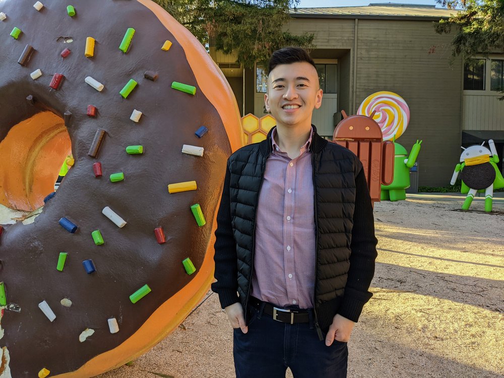 Shawn Sieu, standing in front of the android statue park on the Google campus.