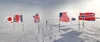 Image showing various countries flags stuck in the snow near the South Pole.