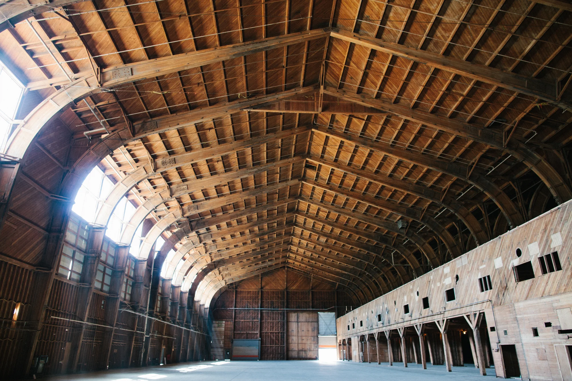 Empty interior of the building with large vaulted ceilings.