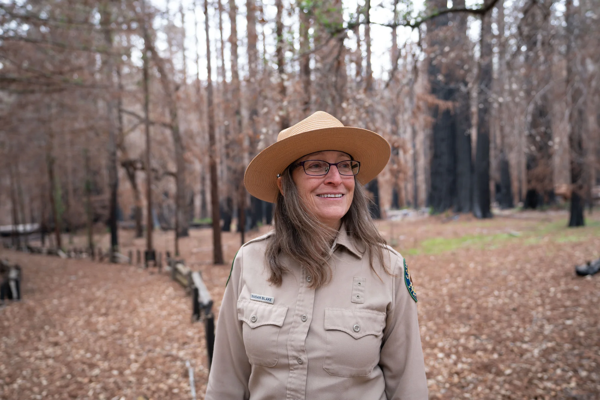 Image of Park Ranger Susan Blake in the woods.