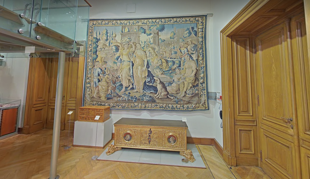 Interior of the Museum of Decorative Arts in Prague, with tapestries hanging on the walls