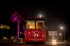 Mobilize Recovery bus parked next to Google campus, lit purple in celebration of recovery month