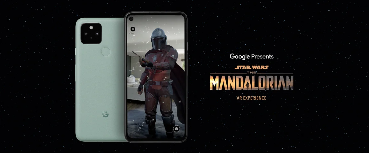 A Pixel phone against a black background. The screen of the Pixel shows the character the Mandalorian on it. Text on the image to the right of the phone reads "Google Presents Star Wars The Mandalorian, an AR experience."