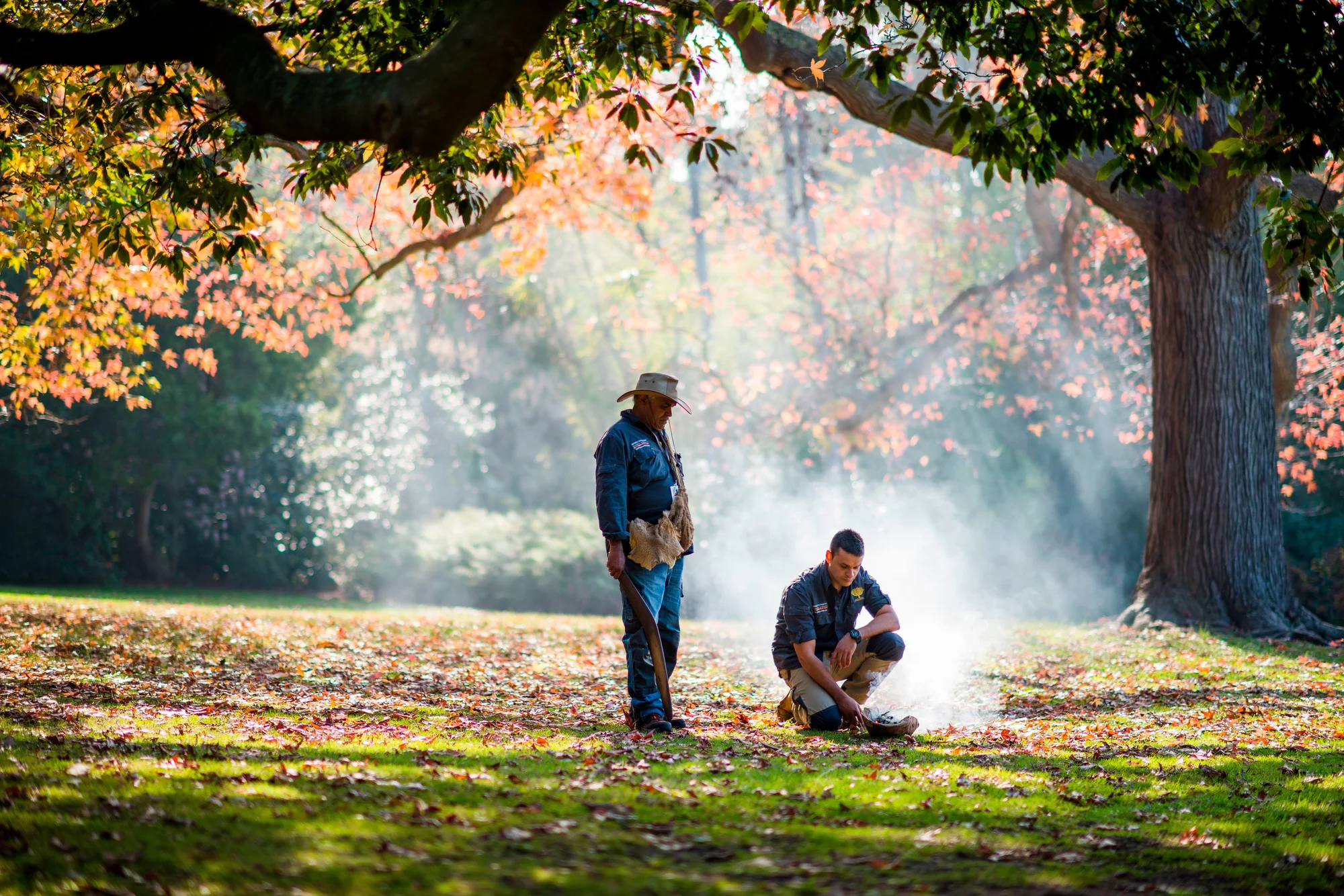 First Nations Cultural Guides performing a smoking ceremony in the Eastern Kulin Nation at Aboriginal Heritage Walk, Royal Botanic Gardens, Melbourne