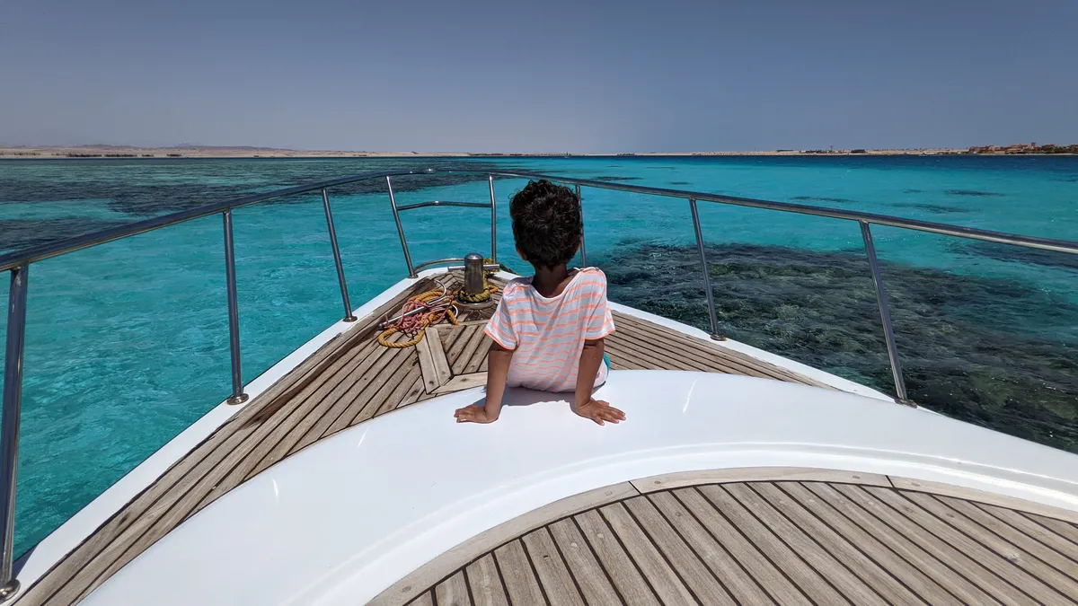 A picture of a child enjoying the views of the beach