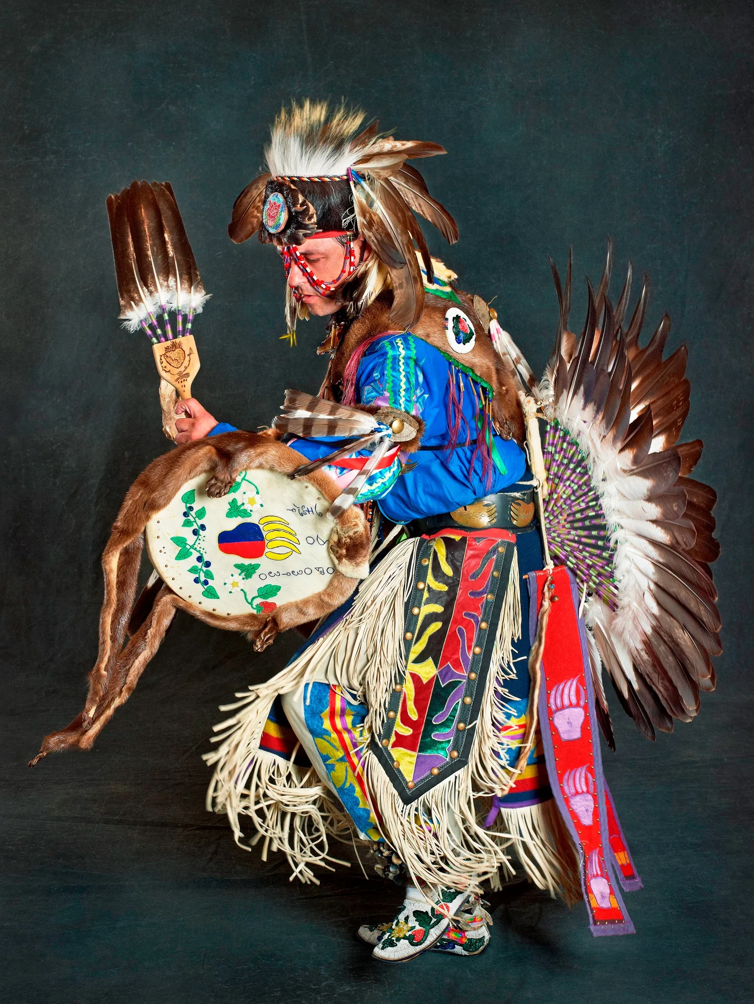 A Potawatomi tribe member is dressed in regalia.