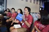 Group of students sitting in chairs wearing CSSI shirts.