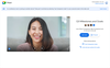 An image of a person looking into the camera and smiling in a Google Meet call.