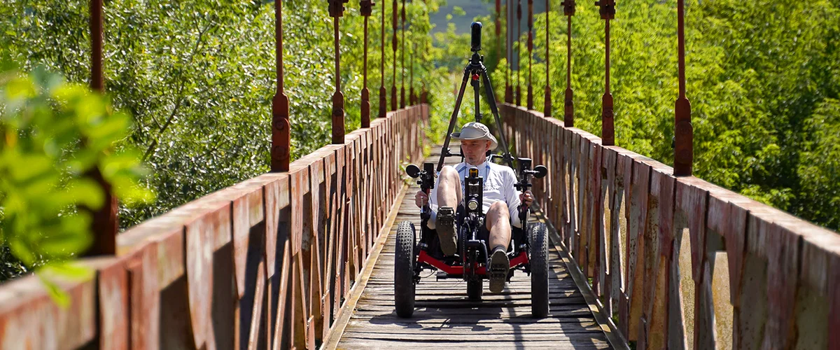 Street View trike going over a wooden bridge.