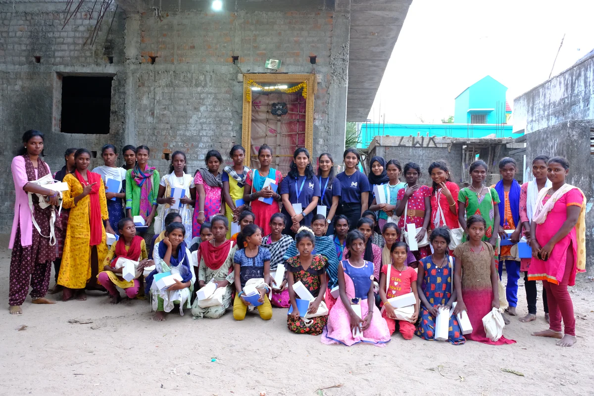 A photo of Dhivya Krishna and WTM Chennai volunteers with some of the girls they educated about technology as part of International Women’s Day 2022.