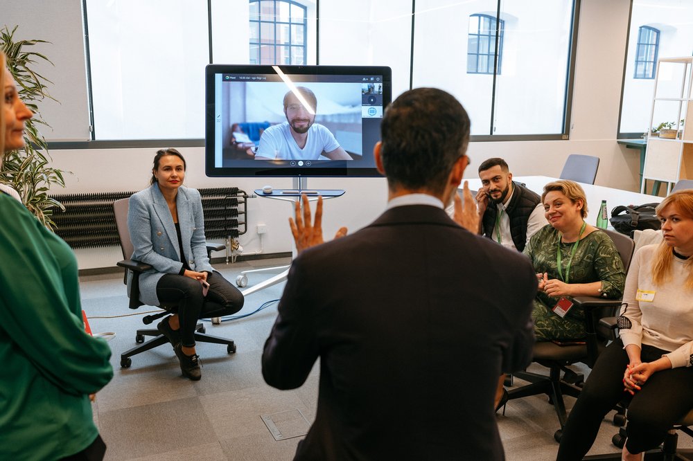 An office showing Mindly’s CEO and co-founder Dimitri Podoliev (on screen) meeting with Sundar Pichai
