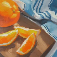 Small canvas oil painting of an orange on a chopping board with a blue and white striped cloth.