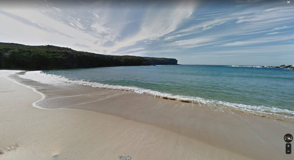 A screenshot of the Street View imagery of Wattamolla Beach, New South Wales – showing the shoreline and pristine water on a sunny day.