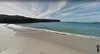 A screenshot of the Street View imagery of Wattamolla Beach, New South Wales – showing the shoreline and pristine water on a sunny day.