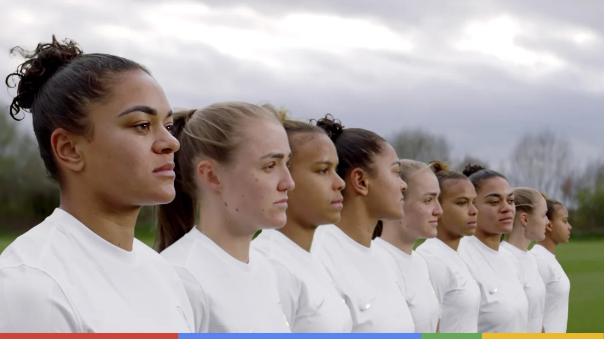 Image of nine of the Lioness football players all standing in a row, ready for action.