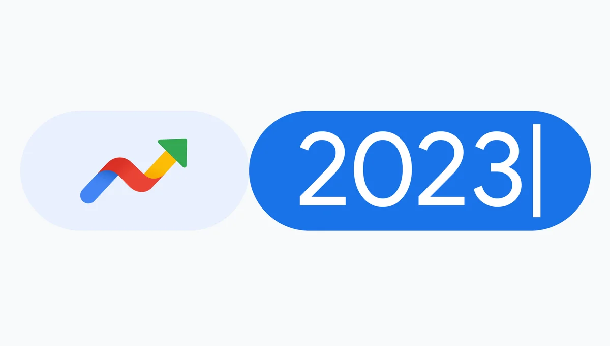 Google Trends icon of an arrow point up next to the number 2023