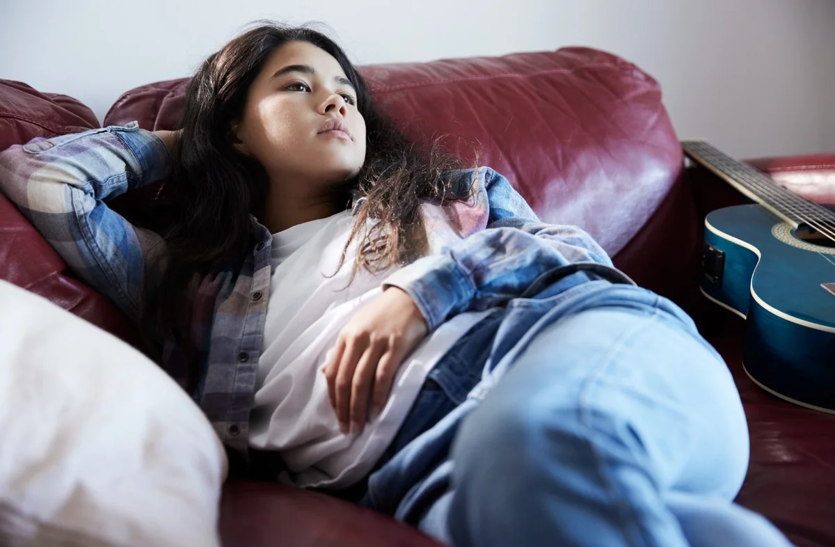 Girl reclined on a couch