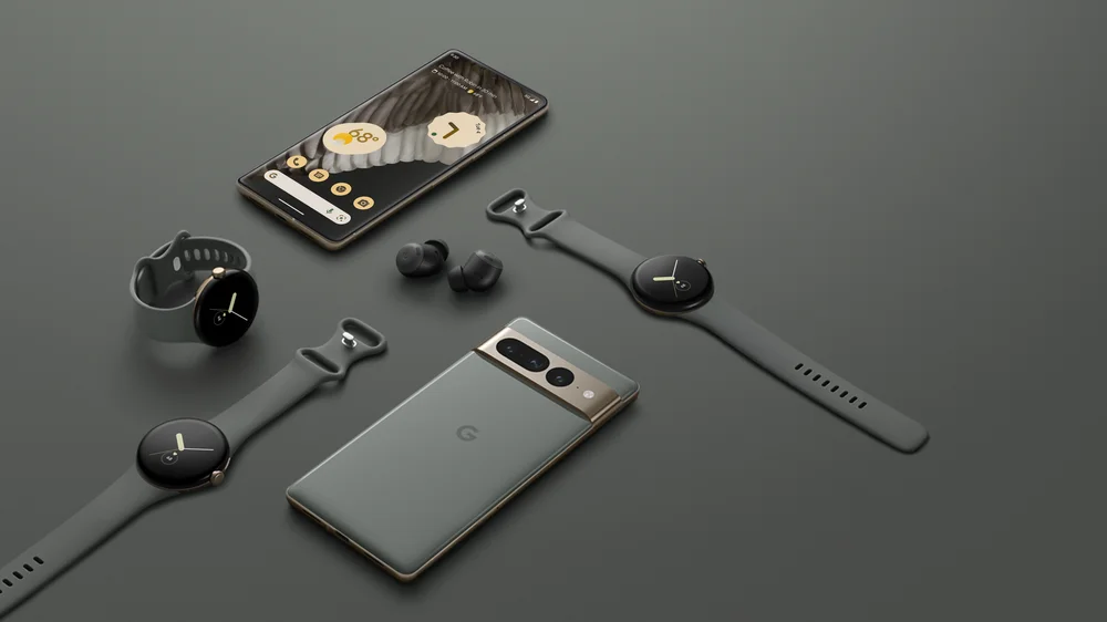 Pixel phones, Google Pixel Watches and Pixel Buds, all with dark gray cases and bands, against a dark gray background