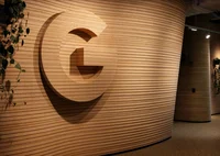 A photo of the carved wooden letter 'G' in the reception area of Google's new Auckland office