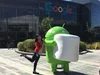 Alison outdoors posing with Android statue at Google headquarters