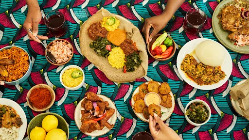 a table with a variety of different plates of food