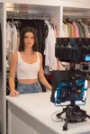 Model Kendall Jenner stands in her walk-in closet in front of a YI HALO camera.