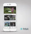 Fitbit Coach smartphone app on cell phone screen showing different lessons, how long they will take, difficulty and how many calories are burned
