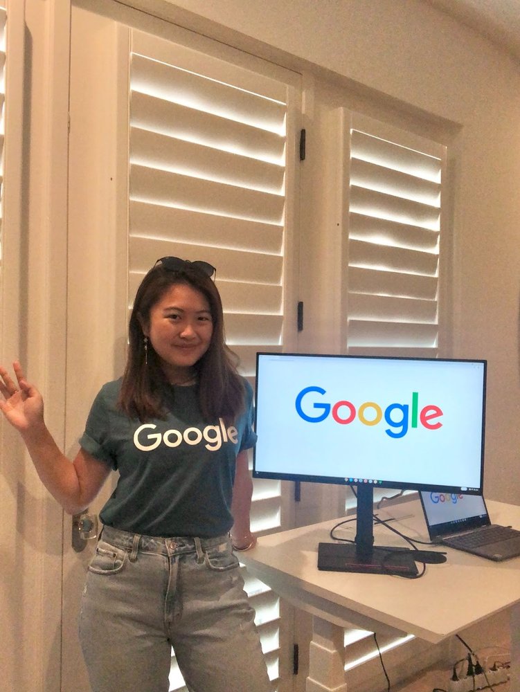 Woman next to monitor wearing a Google shirt