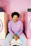 YouTube Creator Jarvis Johnson sitting on a pastel washing machine