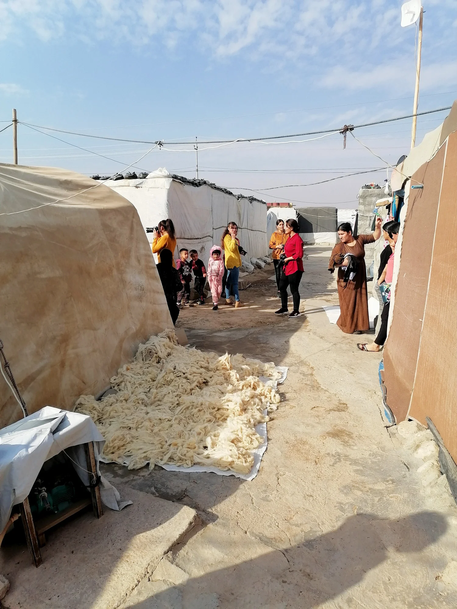 Photo of people taking part in a photography workshop in the IDP camp in Khanki.