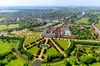 Aerial view of Hampton Court Palace from the east, showing the Great Fountain Garden in the foreground.