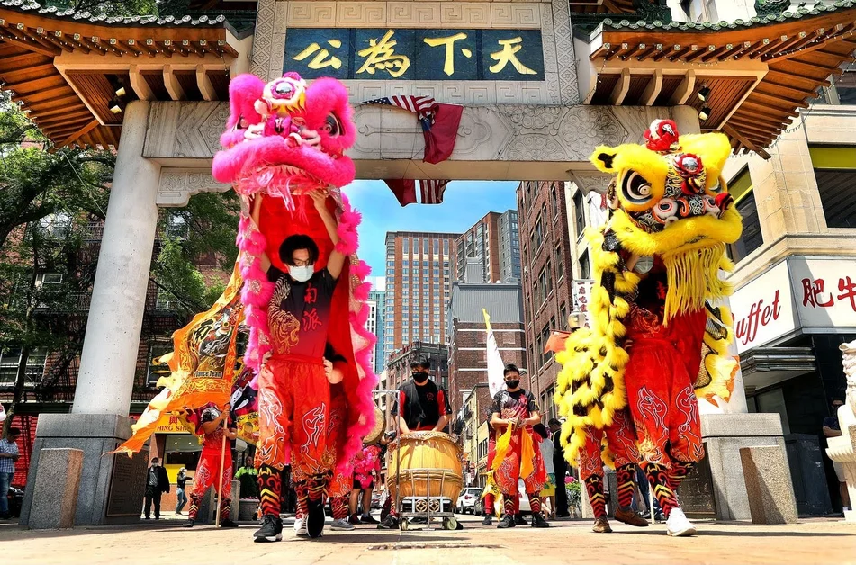 a group performing the lion dance in Boston
