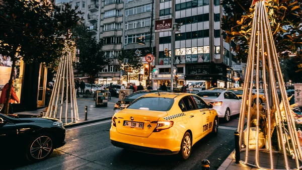 Image of a busy street lined with holiday decor.