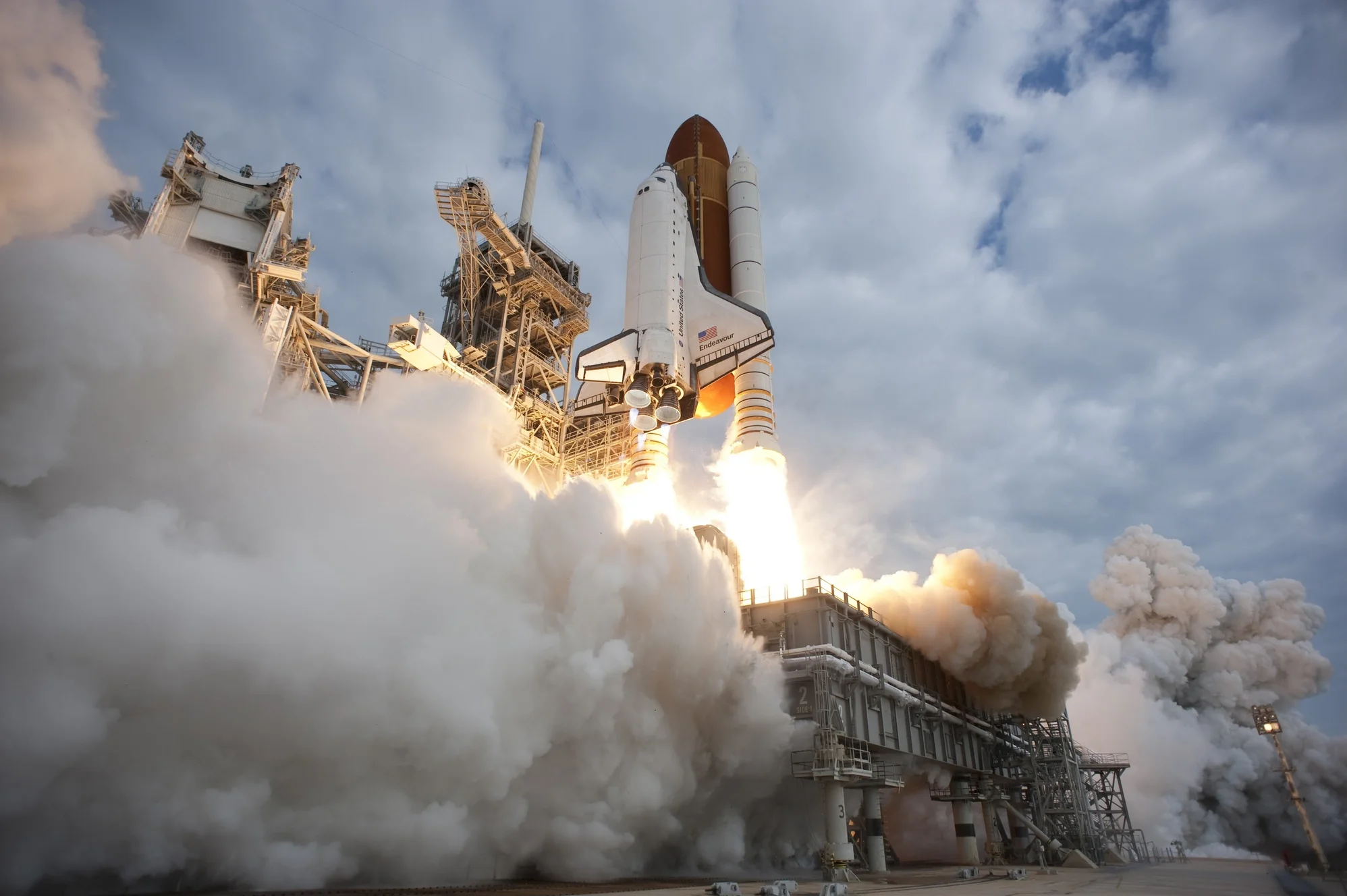 Space shuttle Endeavour rises on twin columns of flame from Launch Pad 39A at NASA's Kennedy Space Center in Florida on the STS-134 mission to the International Space Station.
