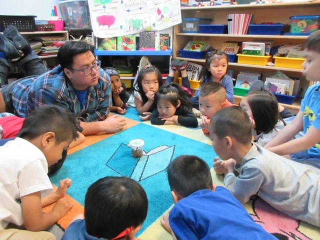 Mr. Yung and his students in his classroom