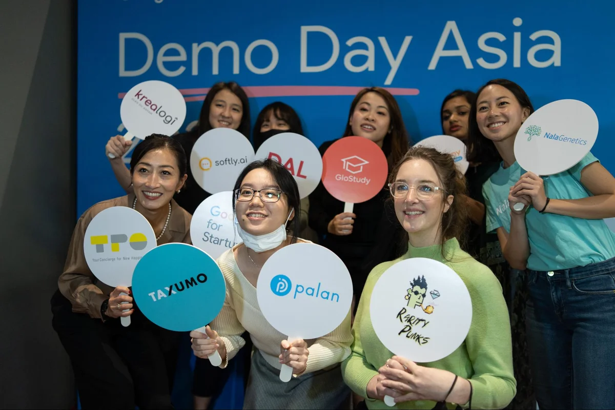 Eight women startup founders from Asia standing on a stage.