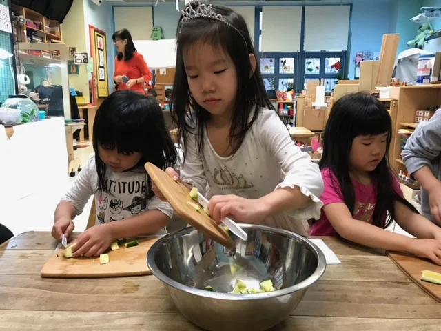 Students preparing food to share with classmates