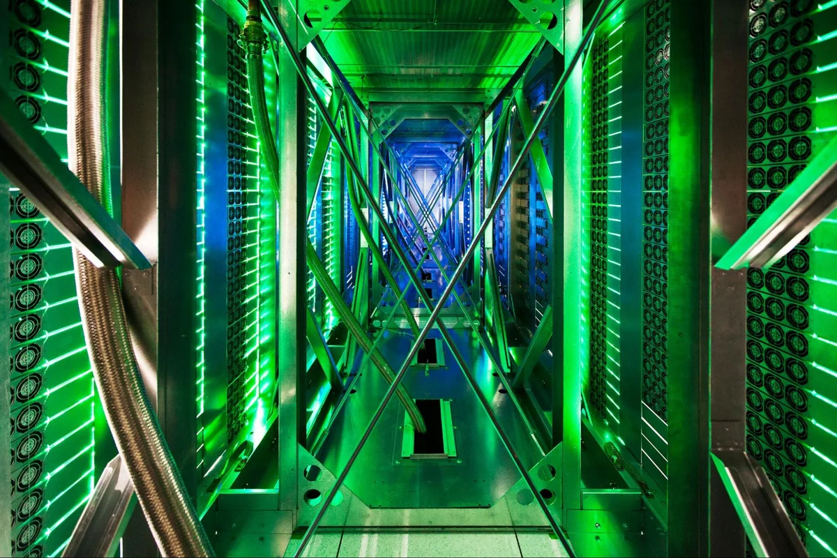 A photo showing green lights inside a Google data center