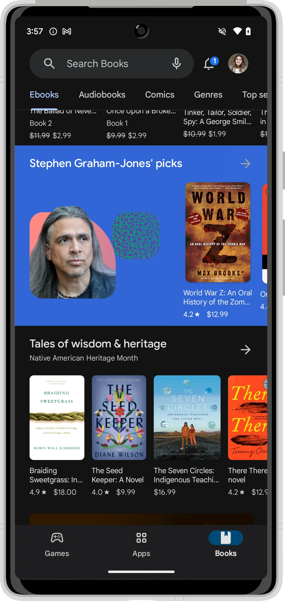 An image of a phone that is in the Google Play Store Book section. There is a blue background spotlighting “Stephen Graham-Jones’” picks, followed by images of book covers in the category of Tales of wisdom & heritage.