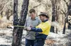 two men measuring a tree one of them is a ranger