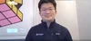 A photo of Ringle founder Seunghoon Lee, looking directly at the camera, wearing a navy jacket with the Ringle logo on.