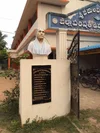 A photo showing a bust of author Suresh Vedula’s grandfather outside the community school built on land his family used to own.