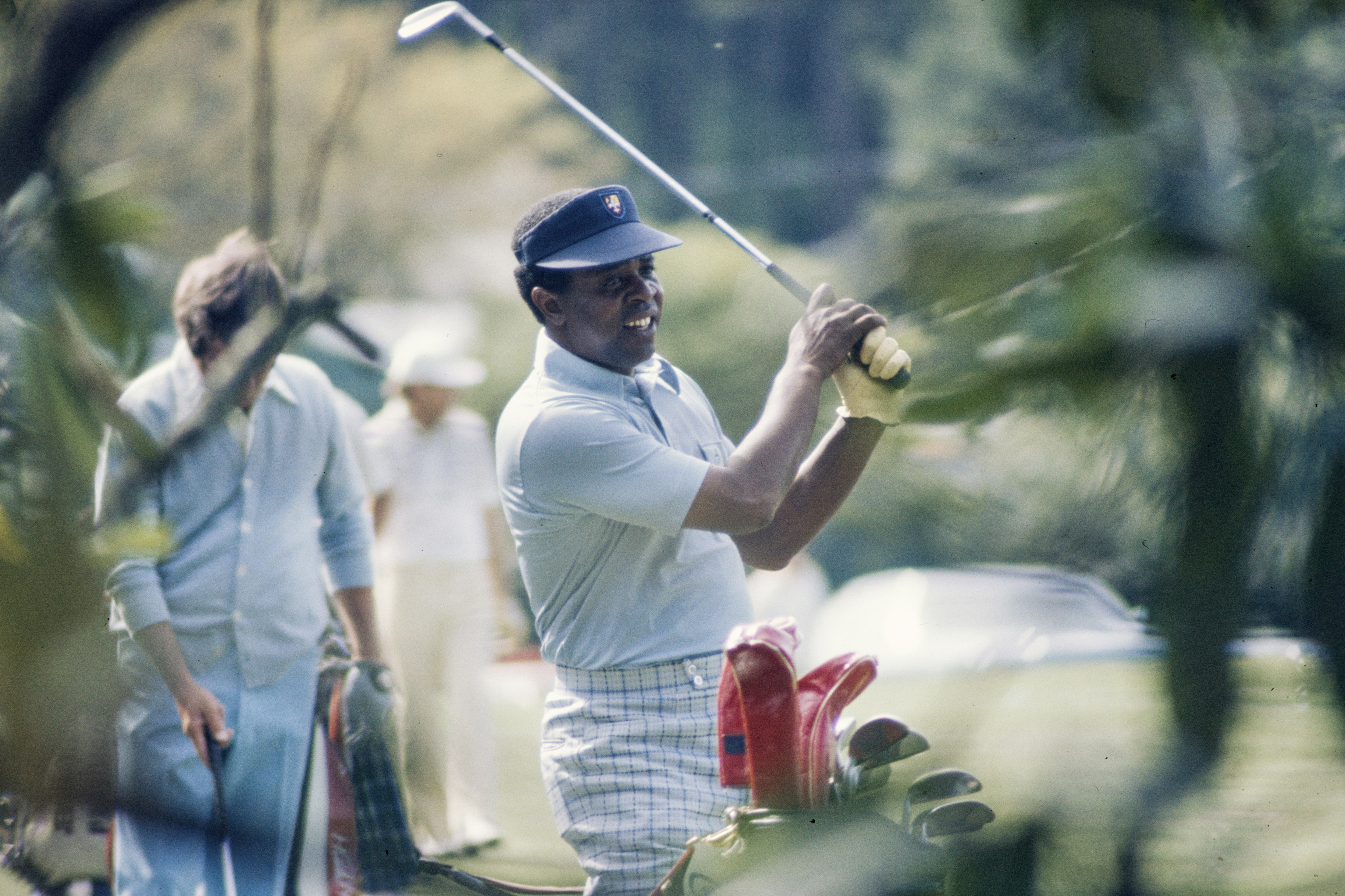 A photo from 1975 of Lee Elder golfing.