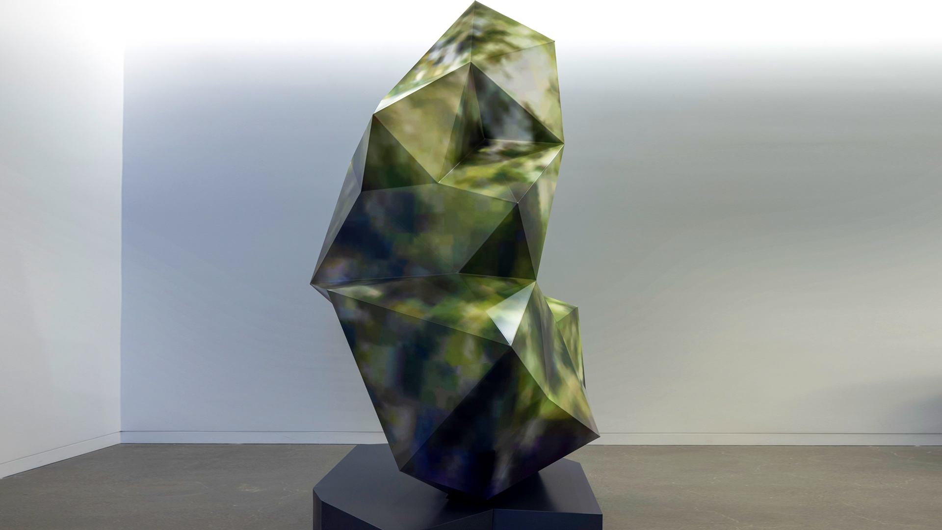 Large polyhedral sculpture, green/brown forest camo.