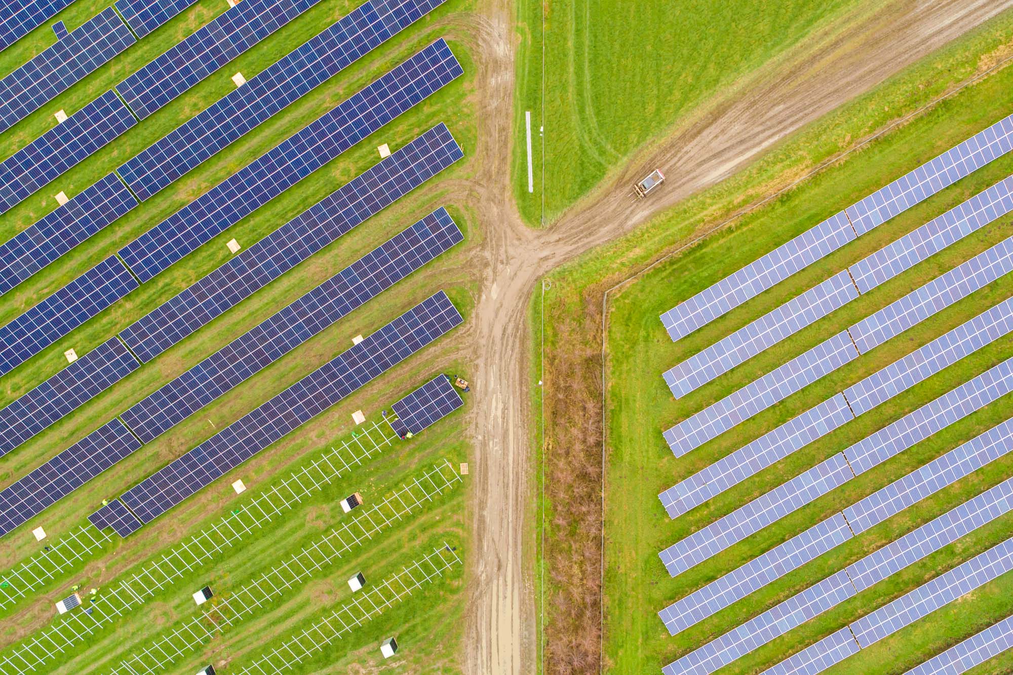 Aerial shot of a field filled with solar panels