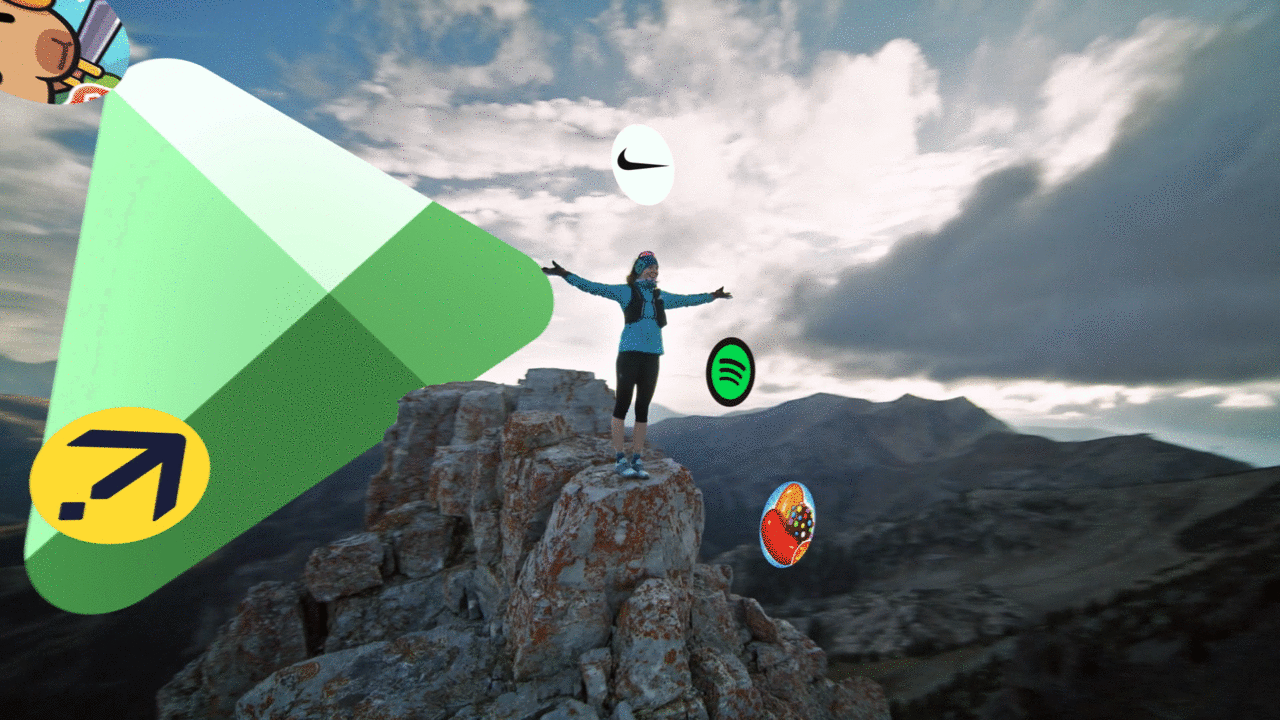 Shows someone on top of a mountain with a variety of apps circling around them