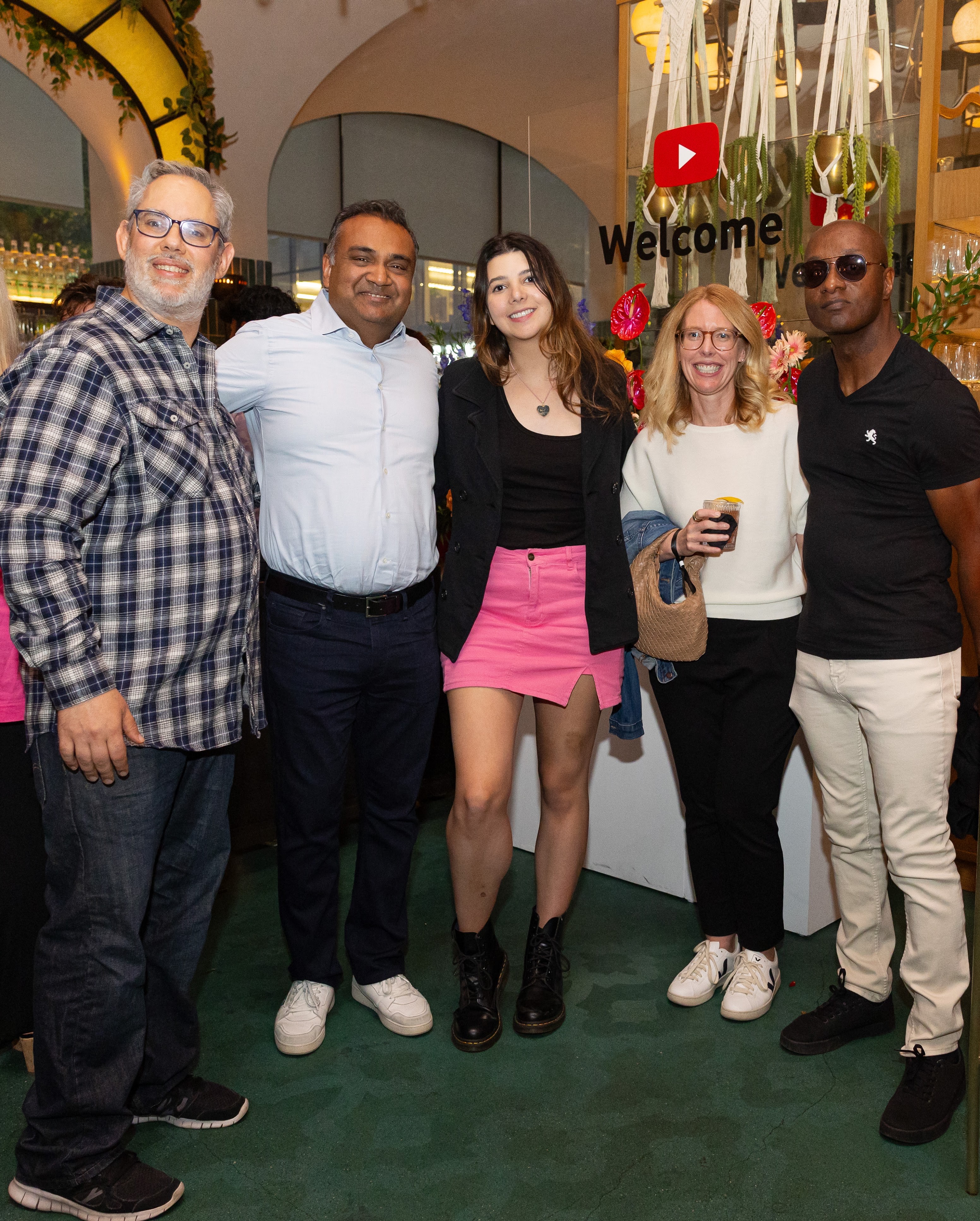 Rene Ritchie standing and smiling with YouTube CEO, Neal Mohan, and several creators