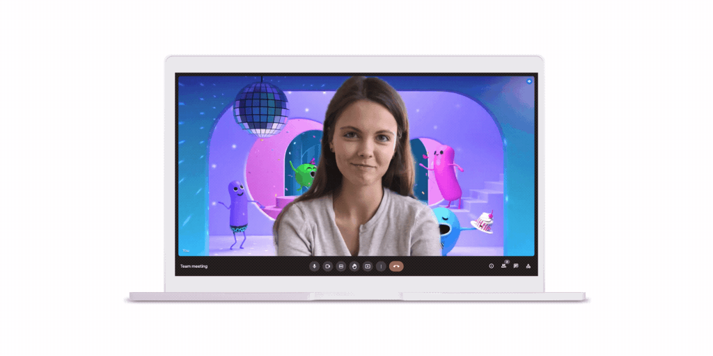Eine Person führt einen Videoanruf über Google Meet mit einem animierten Hintergrund, auf dem Zeichentrickfiguren unter einer Discokugel tanzen, durch.